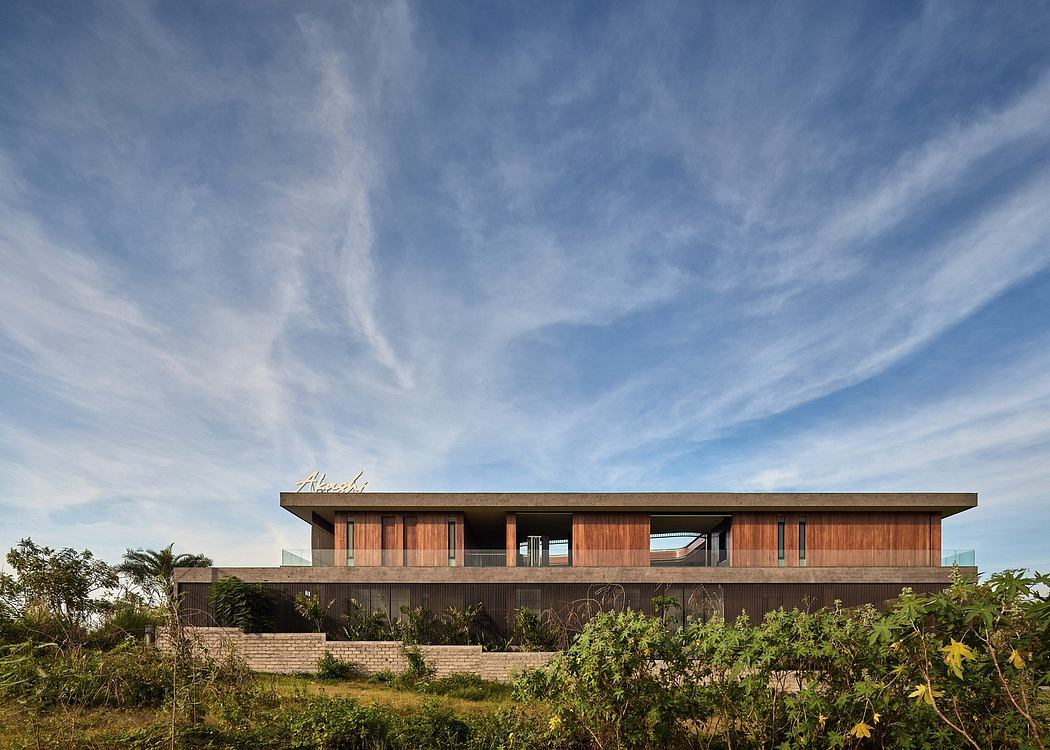 Striking contemporary residence with sleek wooden facade and expansive views.