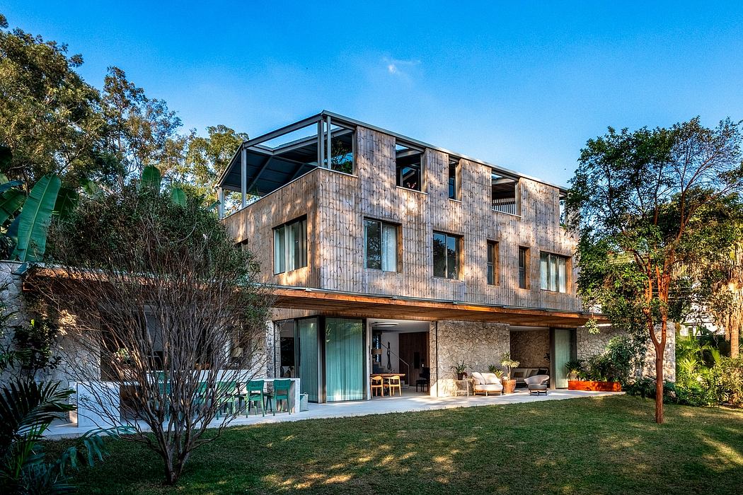Stunning modern wooden and glass villa with expansive outdoor living space.