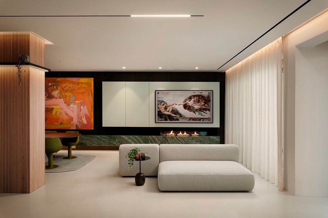 Sleek modern living room with built-in fireplace, large artwork, and minimalist furniture.