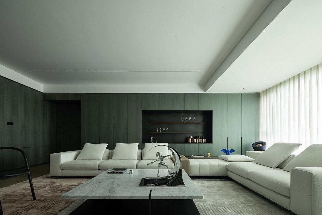 Modern, minimalist living room with sleek dark cabinetry, white sofas, and a marble coffee table.