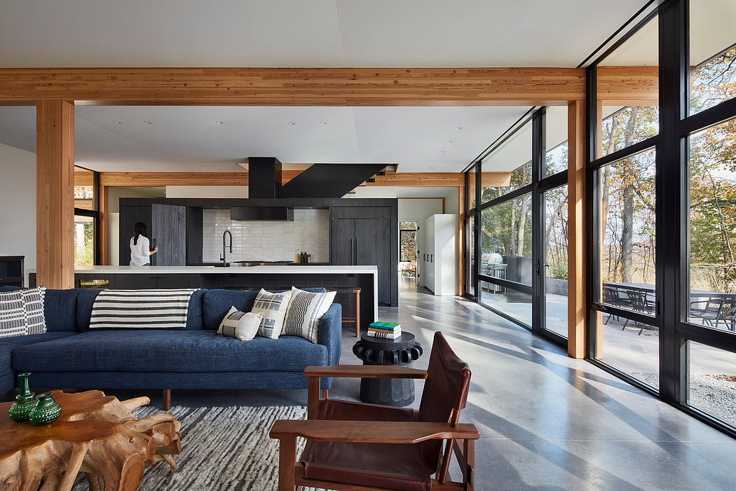 Spacious open-concept interior with large windows, modern kitchen, and cozy living area.