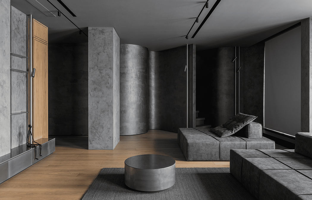 A modern, minimalist bedroom with concrete walls, wooden flooring, and geometric furniture.