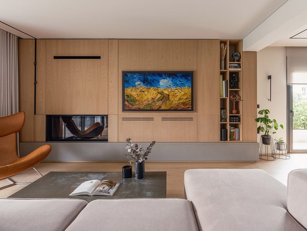 The image showcases a modern living room with a wooden wall panel, a large artwork, and a minimalist fireplace.