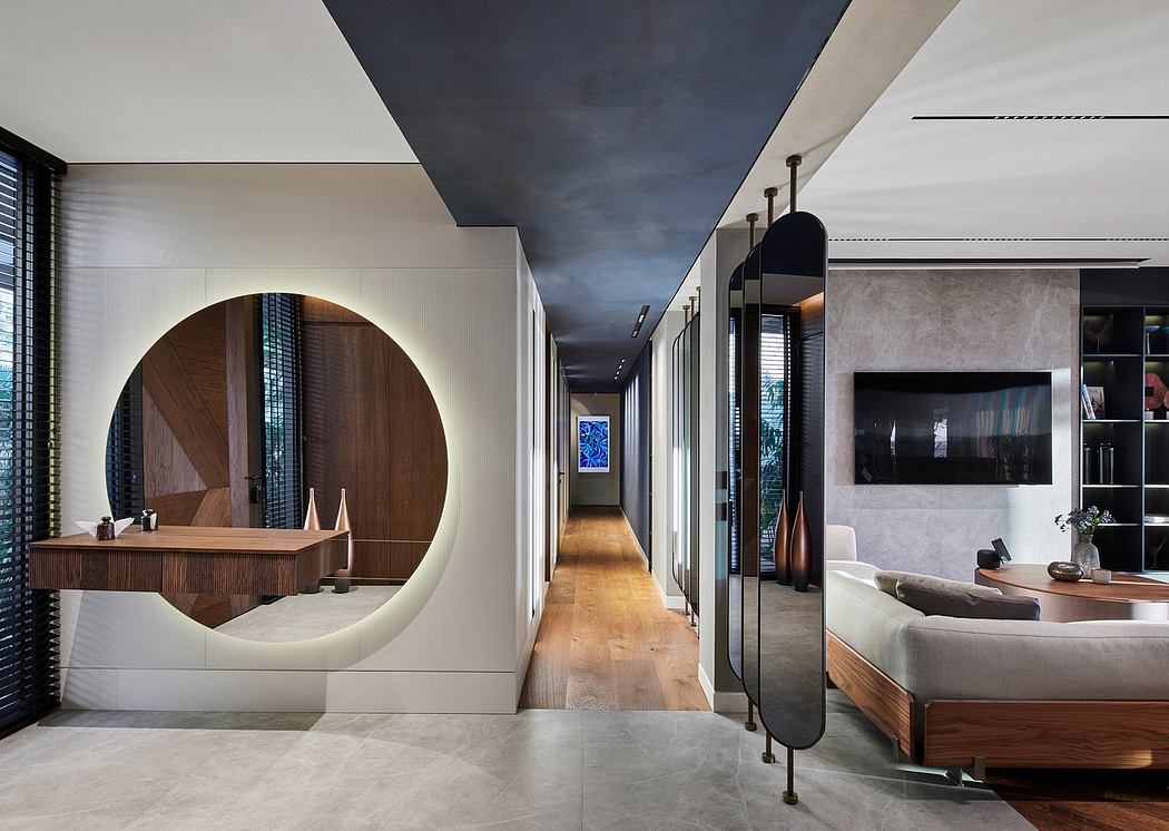 Sleek, modern interior with circular mirror, wood accents, and minimalist decor.