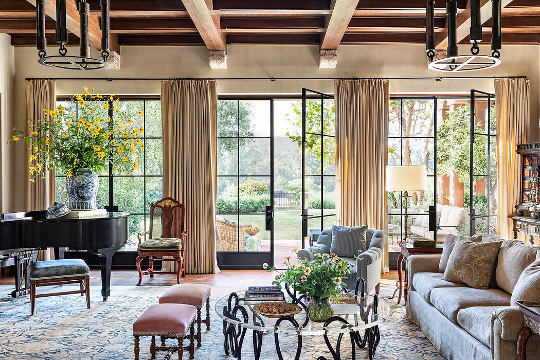 Rustic yet refined living room with beamed ceilings, large windows, and eclectic furnishings.