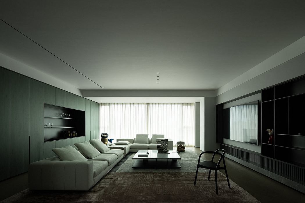 Sleek modern living room with minimalist furniture, large windows, and built-in cabinetry.