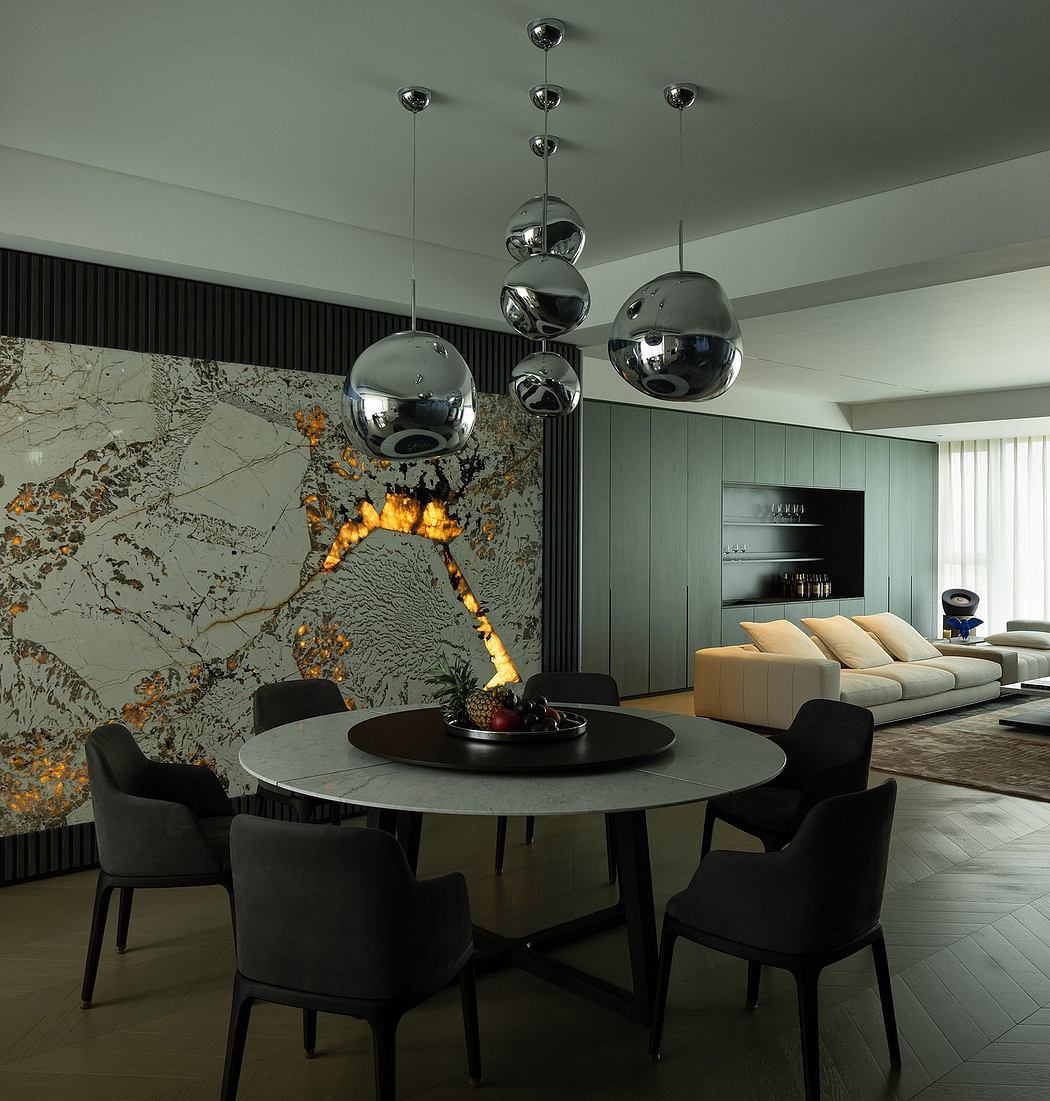 Sleek modern interior with marble accent wall, chrome pendant lights, and minimalist furniture.
