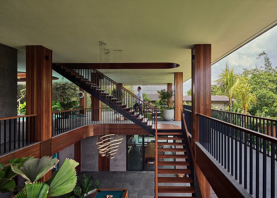 Striking wooden stairs and balconies in modern tropical-inspired architecture.