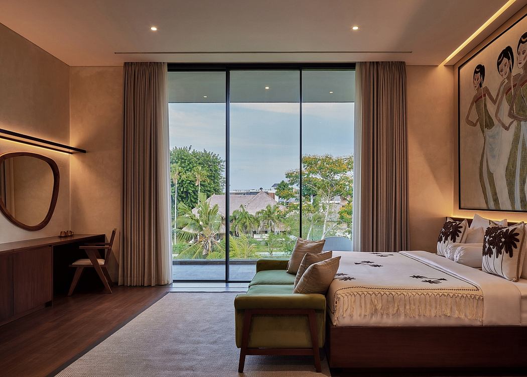 Spacious bedroom with floor-to-ceiling windows, plush furnishings, and lush tropical views.