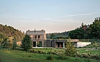 009-country-house-harmoniously-integrates-with-serene-lakeside-setting-in-poland.jpg
