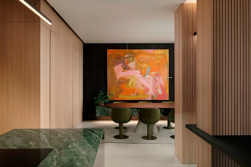 Sleek modern interior with wooden paneling, abstract artwork, and green accents.