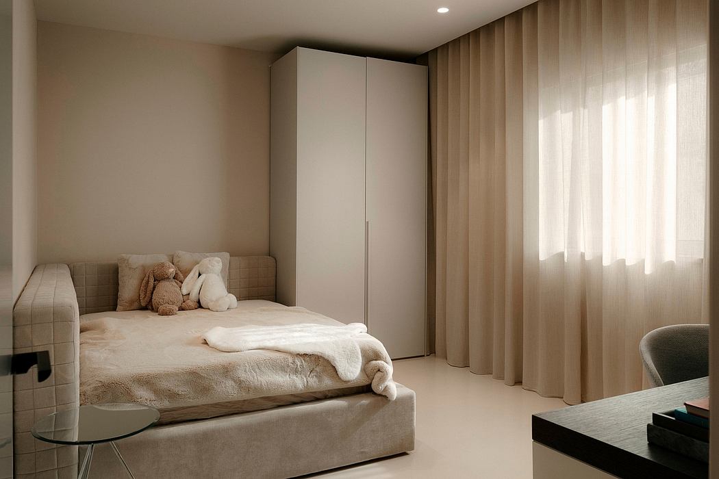 Cozy bedroom with minimalist design, neutral tones, and soft textiles creating a warm ambiance.