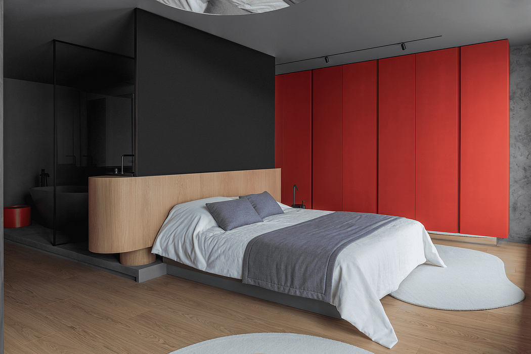 Minimalist bedroom with sleek black walls, red built-in closets, and a wooden platform bed.