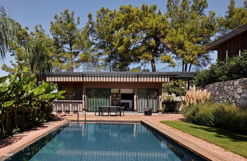 A modern, open-concept home with a sleek, glass-walled patio and an inviting pool.