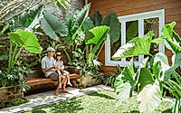 A family enjoy their time at tropical backyard at home