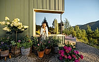 Woman Relaxing by Window in Garden