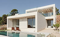 001-stepped-house-opens-up-to-views-across-iberian-hills-around-swimming-pool.jpg