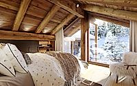 006-guerneres-recasts-the-alpine-chalet-with-warm-timber-and-brass-glow.jpg