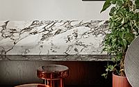 006-kss-apartment-frames-warm-modern-interiors-with-marble-and-velvet.jpg