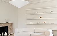 002-marsala-showroom-residential-warmth-shapes-a-kyiv-footwear-boutique.jpg