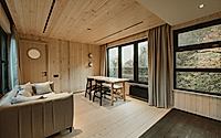 002-hotel-khidi-reframes-forest-views-with-warm-timber-rich-interiors.jpg