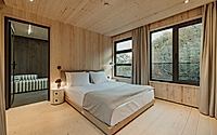 008-hotel-khidi-reframes-forest-views-with-warm-timber-rich-interiors.jpg