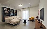 001-apartment-on-via-falcone-frames-warm-modern-living-in-marcianise-italy.jpg