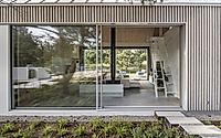 012-kownatki-lake-house-calm-geometry-metal-clad-refuge-in-the-pines.jpg