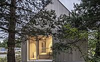 014-kownatki-lake-house-calm-geometry-metal-clad-refuge-in-the-pines.jpg