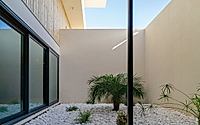 005-casa-nau-64-rewrites-courtyard-living-between-pines-and-lagoon-light.jpg