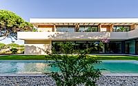 013-casa-nau-64-rewrites-courtyard-living-between-pines-and-lagoon-light.jpg
