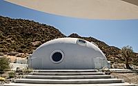 001-hata-dome-captures-mountain-horizons-with-a-sculpted-monolithic-shell.jpg