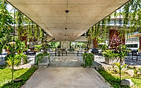 008-phum-sambo-cafe-eatery-concrete-frame-turned-green-dining-retreat.jpg