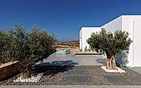 010-fanos-guesthouse-island-courtyard-living-shaped-by-wind-and-greek-sun.jpg