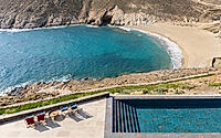 011-villa-jondal-minimalist-coastal-retreat-on-rugged-mykonos-sea-cliffs.jpg