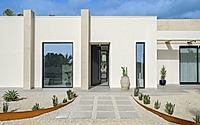 020-house-p02-mediterranean-villa-framed-by-stone-light-and-water-lines.jpg