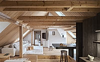 001-cottage-a-vysocina-recasts-the-attic-with-dark-timber.jpg